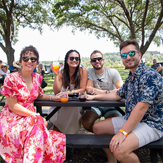 Group of people sitting on the festival grounds