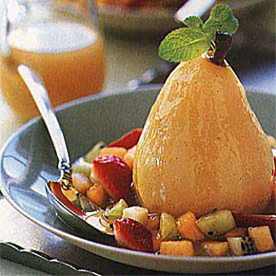 Poached pears with wine and fruit confetti