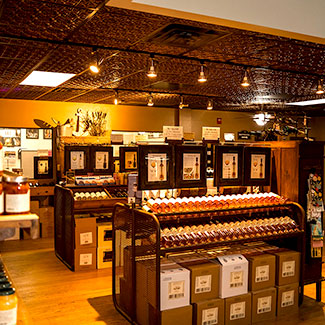 Inside image of the wine shop showing wines on various shelves