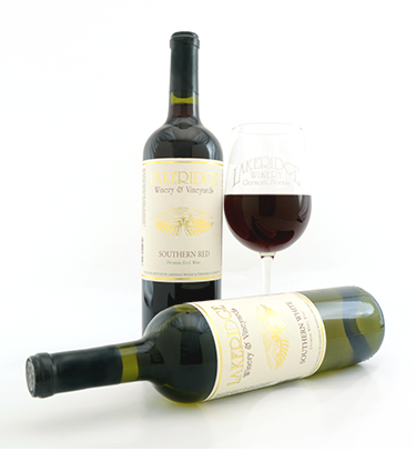 A bottle of Southern Red and Southern White wine with a glass of red wine.